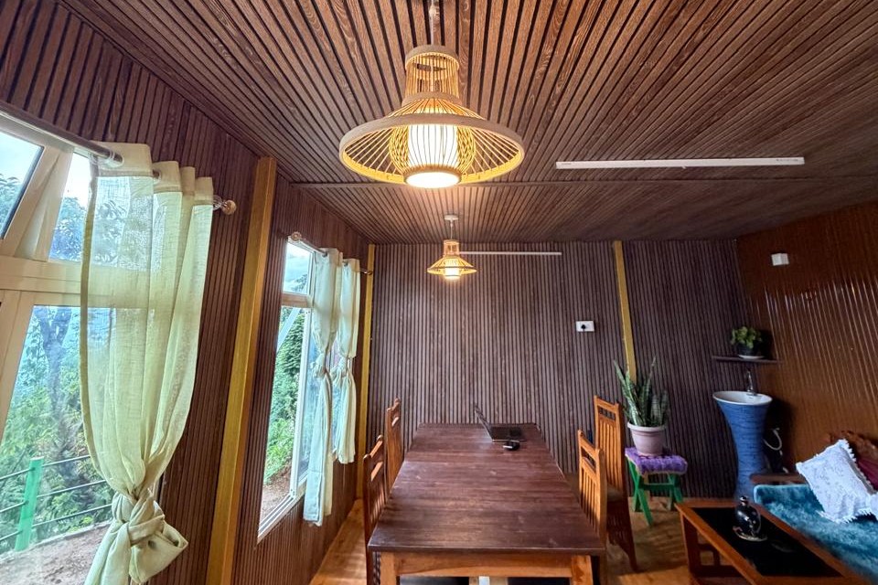 Wood-panelled dining room at Kepchaki Stay where guests eat